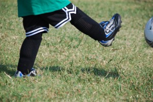 foot kicking soccer ball