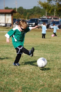 Jonah kicking soccer ball