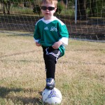 Jonah posing with his soccer ball