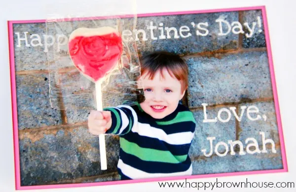 Are you looking for an easy DIY valentines for kids that are inexpensive and quick to put together? These DIY Lollipop Valentines are super cute and a cinch to pull together. The thing that took the most time for me was waiting on the pictures to print, so I could assemble these homemade picture valentines cards for kids. Grab your camera and your favorite little cupid to make these for his or her Valentine's Day class party.