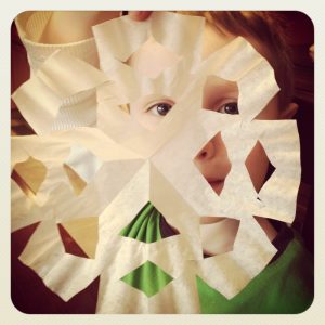 Help preschoolers strengthen fine motor skills and get cutting practice with coffee filter snowflakes. It makes a great winter decoration and is easy for kids to practice cutting.