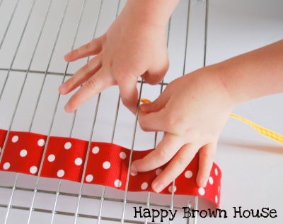 Ribbon Weaving activity for preschoolers from @happybrownhouse www.happybrownhouse.com