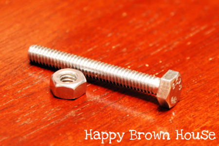 Twisting nuts and bolts for fine motor skills practice from @happybrownhouse www.happybrownhouse.com