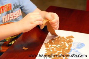 Tearing paper develops Fine Motor Skills @happybrownhouse www.happybrownhouse.com