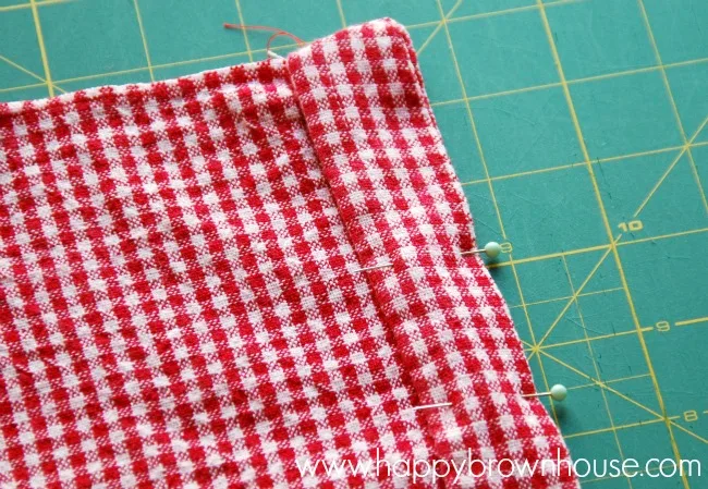 sew a plastic grocery bag organizer from a tea towel