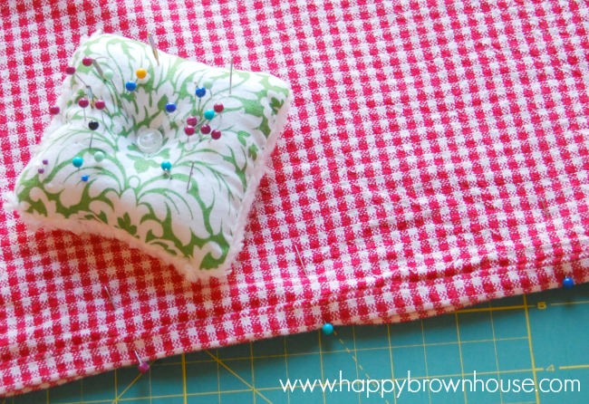pin your tea towel plastic grocery bag holder before sewing to make a straight line