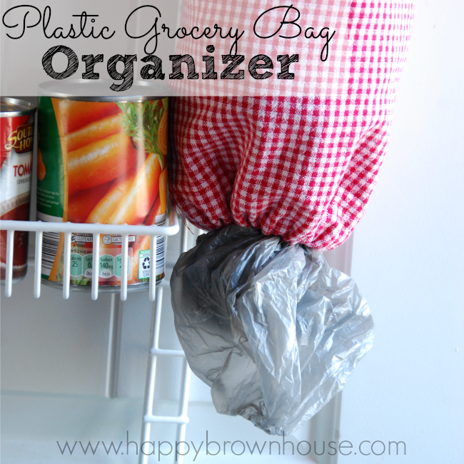 Make a plastic grocery bag organizer made out of tea towels. Perfect for beginner sewing project.