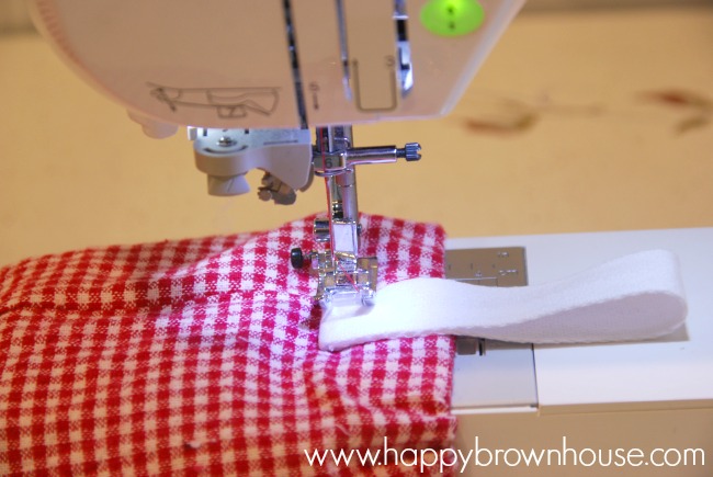 sewing a loop on the plastic shopping bag organizer