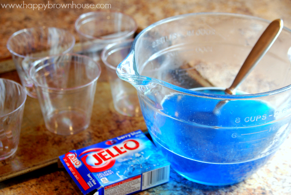 glass mixing bowl with blue Jell-o 