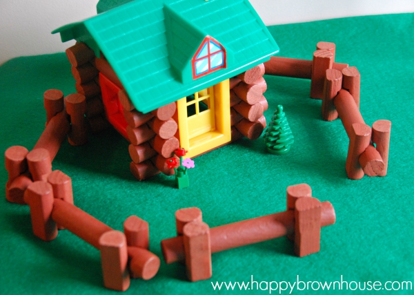 Small World Play house made out of Lincoln Logs