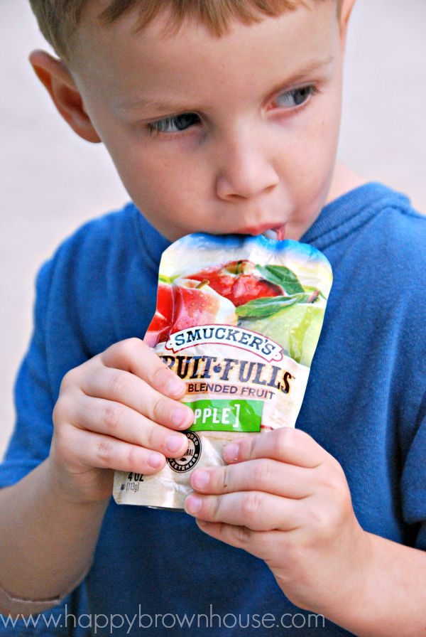 Eating applesauce pouches from Smuckers