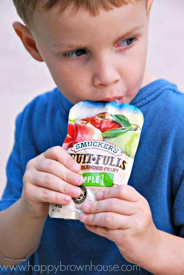 Eating applesauce pouches from Smuckers