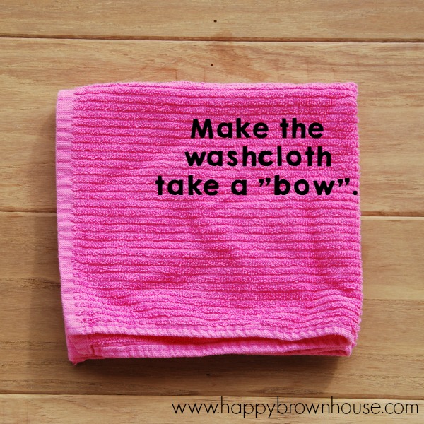 Need help with the laundry? Use this simple trick to teach kids how to fold a washcloth. Give kids independence with folding the laundry with this simple washcloth hack.