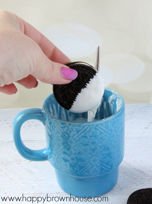 Dipping Oreos in white chocolate candy coating