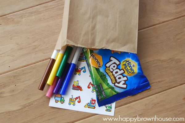 Travel Activity packs with snacks to make traveling with kids easier. 