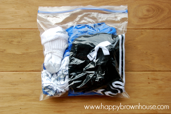 Travel clothes placed in a gallon size storage bag to make trips easier with kids. I love this tip!