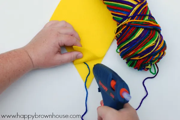 Hot gluing the kite together for the Kite Bow Counting Busy Bag