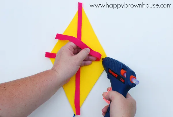 hot gluing the Kite Bow Counting Busy Bag felt kite