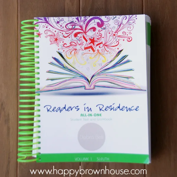 Writers in Residence homeschool writing curriculum spiral workbook on a brown background