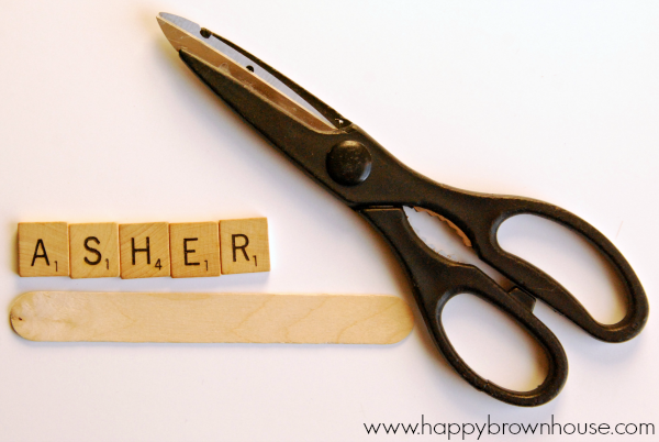 scissors to cut the jumbo craft stick to the smaller size for the Scrabble Tile Name Ornament