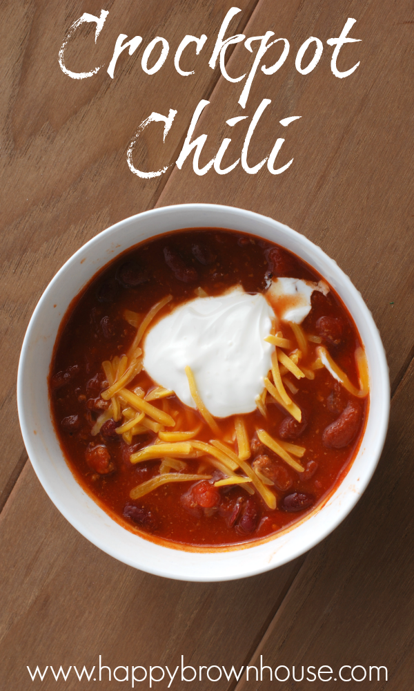 white bowl full of chili topped with cheese and sour cream, Crockpot Chili recipe