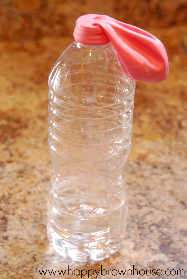 pink balloon attached to a water bottle 