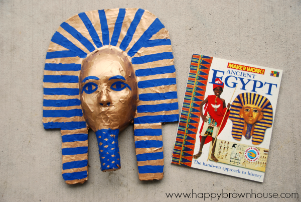 Making a King Tut Burial Mask with kids is a super fun way to finish an Egypt unit study. Kids will love to paper maché and the finished King Tut Mask will be an art project you won't mind keeping on display. #homeschool #kids #craft #kidcraft #ancientegypt #egypt #unitstudy #craftsforkids
