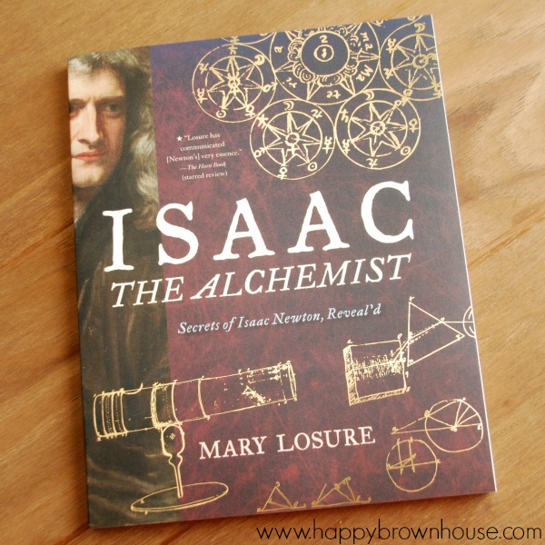 close up of the book Isaac the Alchemist by Mary Losure