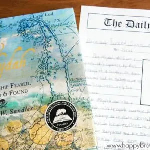 Close up of The Wydah cover and a free printable Newspaper Article writing template