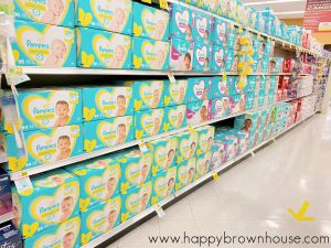 Ingles diaper aisle with Pampers diapers boxes lined up on shelves