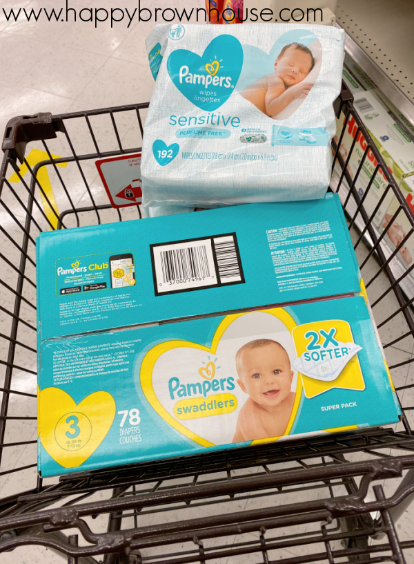Pampers Swaddlers Diapers and Pampers Sensitive Wipes in a grocery cart